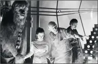  ?? LUCASFILM/COURTESY PHOTOGRAPH ?? In a scene from the 1980 film “The Empire Strikes Back,” Carrie Fisher speaks with director Irvin Kershner during the carbon freezing scene.