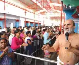  ?? —AFP ?? HYDERABAD: Indian Hindu priest Ranga Rajan instructs devotees during a ceremony to Lord Balaji, known as the ‘Visa God’, at the Chilkur Balaji Temple in Rangareddy district yesterday. President Donald Trump will certainly despise this scene: Hundreds...