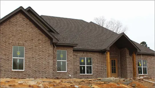  ?? PHOTOS BY SARAH DECLERK/ARKANSAS DEMOCRAT-GAZETTE ?? In addition to four bedrooms and three baths, this Little Rock home, which is slated for completion in July or August, will feature an open floor plan, a vaulted ceiling, a covered back porch and more.