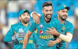  ?? AFP ?? ■ Mohammad Amir (centre) was Pakistan’s best bowler on Wednesday, taking 3/27.