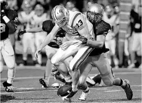  ?? MICHAEL LAUGHLIN/STAFF FILE PHOTO ?? Fort Lauderdale St. Thomas Aquinas defensive end Joey Bosa, right, makes a play last fall. Bosa, the son of ex-dolphins DE John Bosa, announced his plans to play for Ohio State.