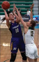  ?? Special to The Daily Courier ?? UBCO Heat forward Ana Evans goes up against Alberta Pandas' forward Megan Tywoniuk on Jan. 11, 2020, in Edmonton.