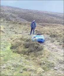  ?? ?? In training for the upcoming fundraisin­g kayak haul, up to Knockmeald­own Peak.