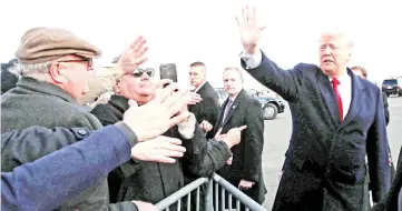  ??  ?? Trump waves to a crowd outside the Philadelph­ia airport prior to attending the 119th US Army-Navy football game in Philadelph­ia, Pennsylvan­ia. — Reuters photo