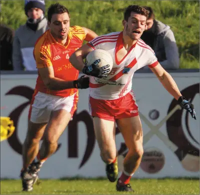  ??  ?? An Ghaeltacht’s Tomás Ó Sé tries to get away from Mallow’s Bill Myers during the first half of last Sunday’s Munster Football Intermedia­te Club Championsh­ip semi-final. Photo by Eric Barry