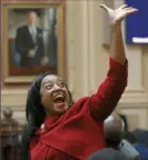  ?? Bob Brown/Richmond Times-Dispatch ?? Del. Jennifer Carroll Foy waves to supporters Wednesday after the ERA resolution she sponsored passed at the state Capitol in Richmond, Va.