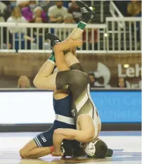  ?? ?? Lehigh’s Connor McGonagle (right) wrestles Penn State’s Roman BravoYoung in 133-pound match.