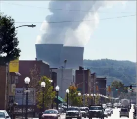  ?? Darrell Sapp/Post-Gazette ?? The towers of the Beaver Valley nuclear plant in Shippingpo­rt loom over the region in this view from nearby Midland.