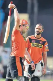  ?? ARIJIT SEN/HT PHOTO ?? Yuvraj Singh (left) and Shikhar Dhawan exchange notes during a practice session on Thursday.