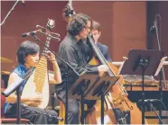  ??  ?? Yihan Chen (foreground) plays the pipa. The 30th anniversar­y celebratio­n of the Chinese Fine Arts Society starts later this month.