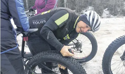 ??  ?? Mike Knowlton, from Hub Cycle in Truro, checked the tires on every fat bike before letting his students onto the trails at Victoria Park on Jan. 4. He led a beginner clinic of about 20 people.