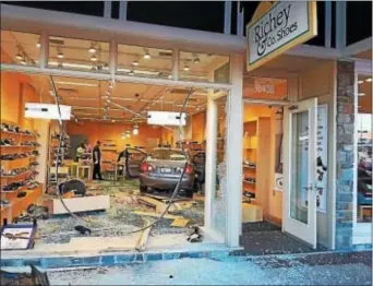  ?? SUBMITTED PHOTO ?? A car sits inside a store at a Rockville, Md., shopping sidewalk and slamming through the front window. center after going up onto the