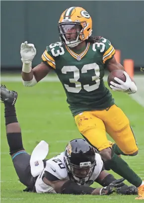  ?? MARK HOFFMAN / MILWAUKEE JOURNAL SENTINEL ?? Packers running back Aaron Jones has gained a combined 3,017 yards with 30 touchdowns since the start of 2019.