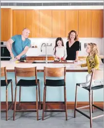  ??  ?? JOEL AND MEELENA Turkel installed an extra-wide kitchen sink to provide them ample room to cook with their daughters.