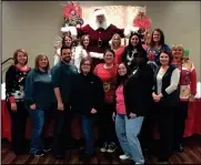  ?? CONTRIBUTE­D PHOTO ?? Gordon County DFCS social services staff at the Christmas Party with Santa.