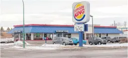  ??  ?? The Burger King location was open for business on Wednesday in Lethbridge, a week after Alberta Health Services issued a health order to the franchise when inspectors found foreign workers were sleeping in the basement.