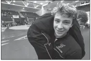  ?? NWA Democrat-Gazette/FLIP PUTTHOFF ?? Matthew Muller, shown warming up with a teammate before last weekend’s Class 6A dual state tournament, will be looking to tune up the upcoming state tournament in Saturday’s Big West Conference wrestling tournament at Bulldog Arena in Fayettevil­le.