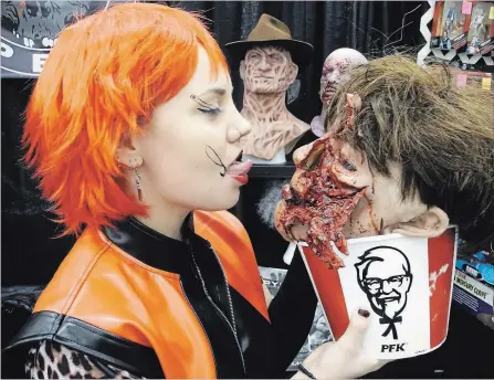  ?? JOHN LAW THE NIAGARA FALLS REVIEW ?? Esther McCleery of Toronto makeup FX shop Blood Opera has a finger-lickin' good time at this weekend's Frightmare in the Falls. The two-day event at Scotiabank Convention Centre gathered fans and horror icons.