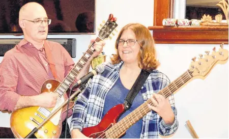  ?? ELIZABETH PATTERSON/CAPE BRETON POST ?? Dr. Tom Hewlett and Dr. Susan Ritcey are two Cape Breton doctors who enjoy performing music.