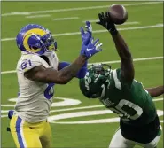  ?? ASHLEY LANDIS — THE ASSOCIATED PRESS ?? New York Jets free safety Marcus Maye, right, breaks up a pass intended for Los Angeles Rams tight end Gerald Everett during the second half of Sunday’s game.