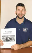  ?? MICHAEL HOFMANN JR. ?? Michael Hofmann Jr. holds a copy of his new book on the 1981-82 Northern Lehigh boys basketball team, which reached the PIAA Class 2A finals. The current Bulldogs football team is trying to duplicate the feat Friday night against Southern Columbia.