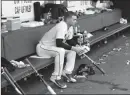  ?? ASSOCIATED PRESS ?? ATLANTA BRAVES starting pitcher Sean Newcomb sits on the bench after losing his bid for a no-hitter in the ninth inning of Sunday’s game against the Los Angeles Dodgers in Atlanta.