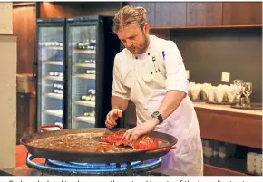 ??  ?? Earl works hard to showcase the natural beauty of the ingredient­s at La Bimba, evidenced in this lobster paella which highlights the natural flavours of the crustacean. — AirAsia