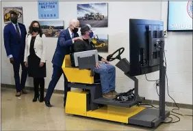  ?? EVAN VUCCI — THE ASSOCIATED PRESS ?? President Joe Biden tours the Internatio­nal Union Of Operating Engineers Local 324 training facility Tuesday in Howell, Mich. Michigan Lt. Gov. Garlin Gilchrist, left, and Michigan Gov. Gretchen Whitmer second from left, look on.