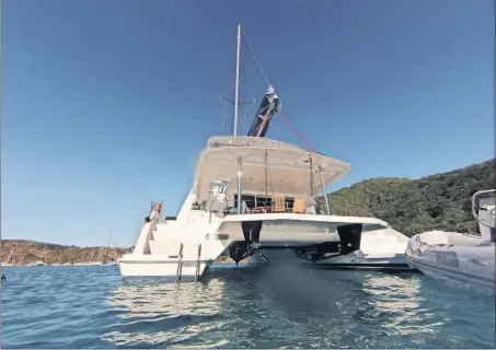  ?? [HILLARY RICHARD/FOR THE CHICAGO TRIBUNE/TNS] ?? Our catamaran, moored in the Caribbean during a snorkel break.