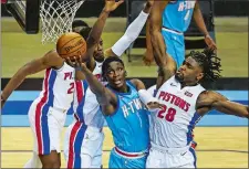  ?? TROY TAROMINA/POOL PHOTO/AP PHOTO ?? Houston Rockets guard Victor Oladipo (7) shoots as Detroit Pistons center Isaiah Stewart (28) defends during the fourth quarter of an game on March 19 in Houston.