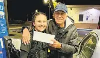  ?? OCEANSIDE POLICE OFFICER JENNIFER ATENZA ?? Oceanside Police Officer Annalina Felicella with an act of kindness recipient after she paid to fill his gas tank.