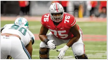  ?? DAVID JABLONSKI / STAFF ?? Ohio State’s Thayer Munford, lining up against Tulane last Saturday, usually races to the end zone to pick up OSU running backs and wide receivers when they score. Munford, a sophomore, is a first-year starter at left tackle.