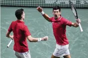  ?? MANU FERNANDEZ AP ?? Serbia’s Nikola Cacic, left, and Novak Djokovic celebrate their victory in doubles over Kazakhstan that earned Serbia a place in the Davis Cup semifinals.