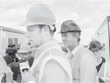  ?? Lorraine Hjalte/calgary Herald ?? Rick Fraser, associate minister of Regional Recovery Reconstruc­tion, left, and High River Mayor Emile Blokland toured Saddlebroo­k, the new High River neighbourh­ood for people left homeless by flooding.