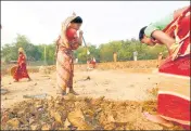  ?? REUTERS FILE ?? Women work at a constructi­on site under MGNREGS.