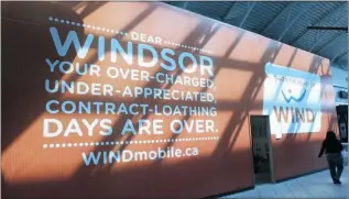  ??  ?? JASON KRYK/The Windsor Star A WINDmobile.ca sign is displayed in Devonshire Mall on Thursday.