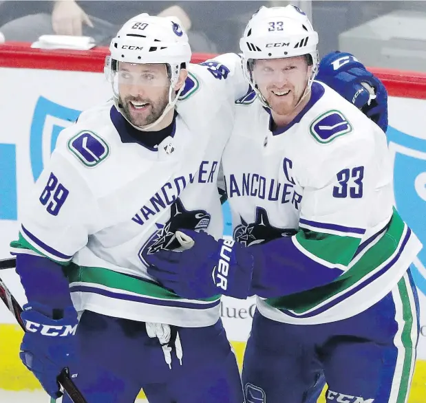  ?? — CP FILES ?? Sam Gagner, left, celebrates a goal with Henrik Sedin during action last season. Gagner, who signed a three-year, US$9.45-million deal with the Canucks last summer, says he did his best to support boyhood pal John Tavares during the sometimes difficult...