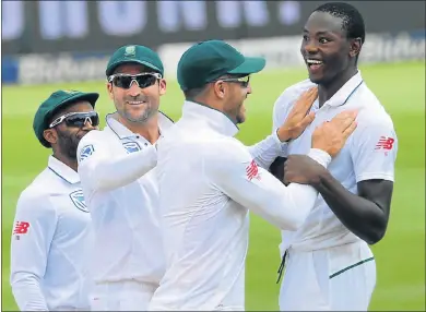  ?? Picture: GALLO IMAGES ?? YOU BEAUTY: Faf du Plessis and fast bowler Kagiso Rabada, of the Proteas, celebrate a wicket with teammates Temba Bavuma and Dean Elgar, left, on Saturday in the third test between South Africa and Sri Lanka at Bidvest Wanderers