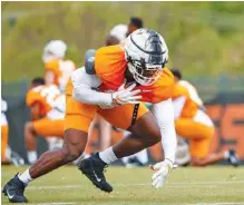  ?? TENNESSEE ATHLETICS PHOTO BY KATE LUFFMAN ?? Tennessee outside linebacker Byron Young goes through a practice drill last week on Haslam Field.