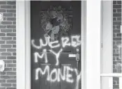  ?? TIMOTHY D. EASLEY/AP ?? Graffiti is seen on a door of the home of Senate Majority Leader Mitch McConnell on Saturday in Louisville, Kentucky.