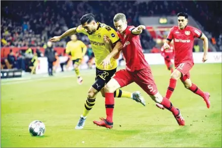  ?? AFP ?? Dortmund’s German midfielder Emre Can and Leverkusen’s German defender Sven Bender vie for the ball during the German first division Bundesliga football match in Leverkusen, Germany on Saturday.