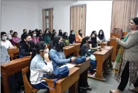  ?? ?? Representa­tional photo: Students attend a class at Shri Ram College of Commerce (SRCC) at Delhi University in New Delhi on 17 February.