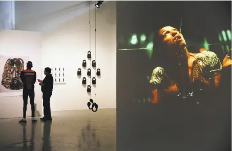  ?? Santiago Mejia / The Chronicle ?? Top: “A History of Violence,” an exhibition at SOMArts, includes, at left, “103 Shots,” a 2016 digital video that is a response to the deadly attack on the Pulse nightclub.
