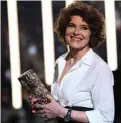  ??  ?? French actress Fanny Ardant smiles as she holds her trophy after she won the Best Actress in a Supporting Role award for “La Belle Epoque”.