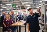  ?? SUBMITTED ?? Kevin Longenecke­r, an Auburn Advanced Manufactur­ing student from Berkshire, demonstrat­es the CNC machine to business leaders, school administra­tors and government representa­tives.