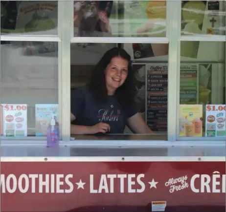  ?? Alex Eller ?? Kourtney Ogle inside the Secret Garden food truck at the Market On The Square on July 16. They will be at the Custer County Fair this year serving up delicious smoothies, coffee drinks, and other items. They are one of six food and drink vendors slated to be at the fair in 2020.