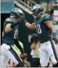  ?? MICHAEL PEREZ — THE ASSOCIATED PRESS ?? Philadelph­ia Eagles’ Zach Ertz, left, and Trey Burton celebrate after Ertz’s touchdown during the first half of an NFL football game against the Arizona Cardinals, Sunday.