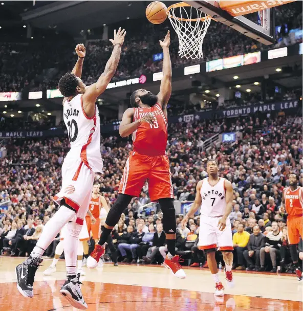  ?? — THE CANADIAN PRESS ?? The Houston Rockets’ James Harden goes up for two of his game-high 40 points Sunday against the Toronto Raptors at the ACC. Defending is Raptors’ DeMar DeRozan. The Raptors blew a fourth-quarter lead for the second straight game in a 129-122 loss.