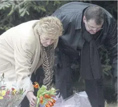  ?? ?? Willie and Margaret Caldwell leave flowers for their daughter