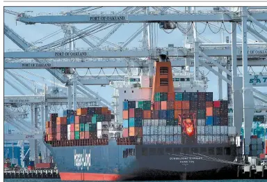  ?? AP ?? A container ship is unloaded recently at the Port of Oakland, Calif. President Donald Trump says trading partners have not treated the U.S. fairly and has vowed to address that.